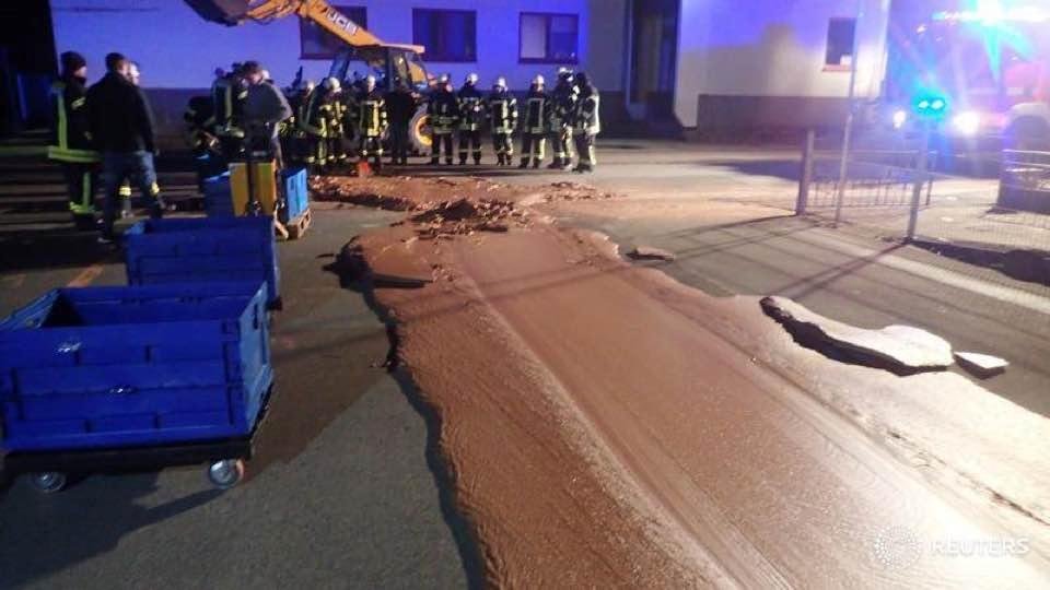 Chocolate spill in Germany has firemen shoveling molten chocolate off the road as it starts to freeze.