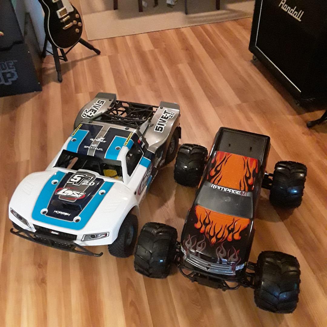 Here's a picture of my Losi 5t next to the Rampage...The losi is much bigger and is the biggest trophy truck that has ever been made...