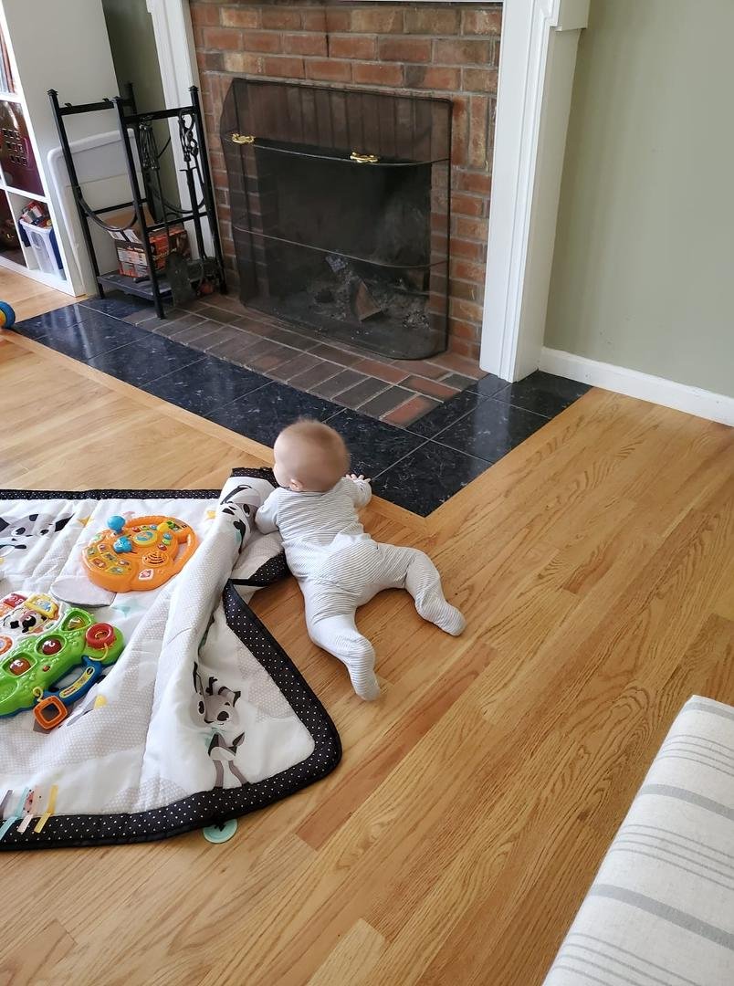 One second after sitting up we were gracefully down again. We are days away from 8 months old