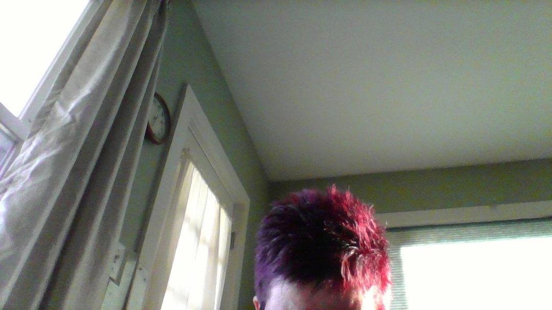 I don't like my picture taken Sandy Black but here is a picture of my new color highlight and cut!!!   It is reddish brown with violet highlights and short I love it !!    Romeo does too!!!  Thank you again Erika EM Clayton