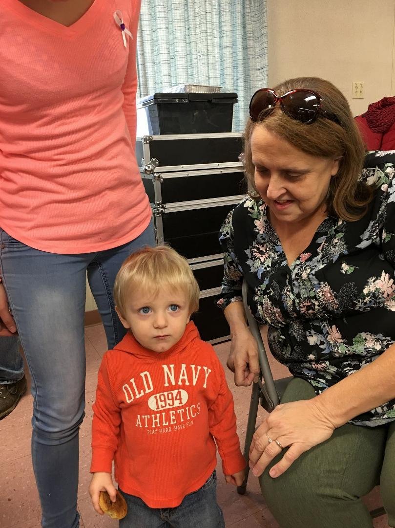 At a great surprise ,@Diane benefit .mom &great grandson Jackson.