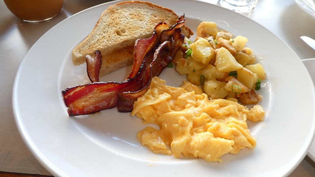 Thick-cut maple bacon with scrambled eggs.