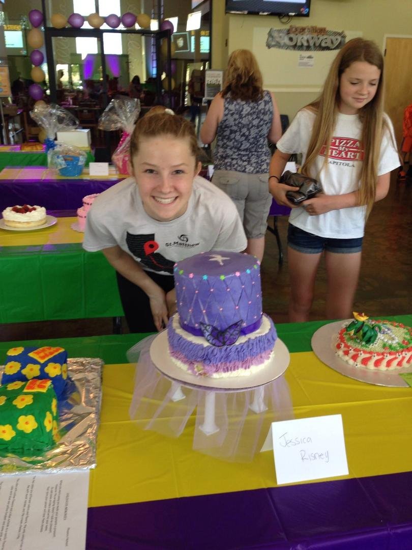 Here's Jessica with the cake she baked last weekend for the cake auction at St. Matthew's Lutheran Church. She put a bunch of time and effort into the preparation and I have it on good authority from the person who made th