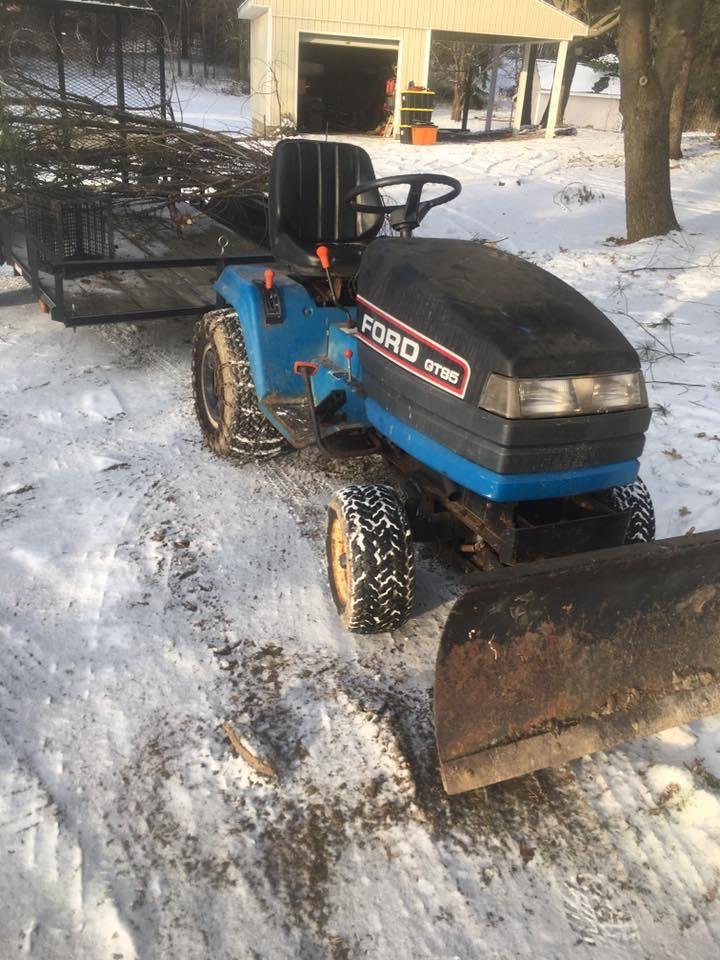 Ford garden tractor. NO MOWING DECK Hydraulic plow, kohler 22hp, new battery last season, wheel weights and chains, runs great! Awesome for plowing and moving stuff around the yard.