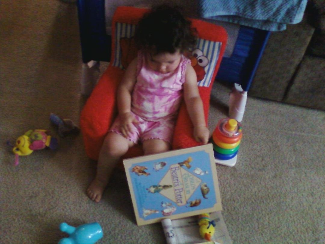 FWD:Sitting in her chair with her book
Sitting in her chair with her book