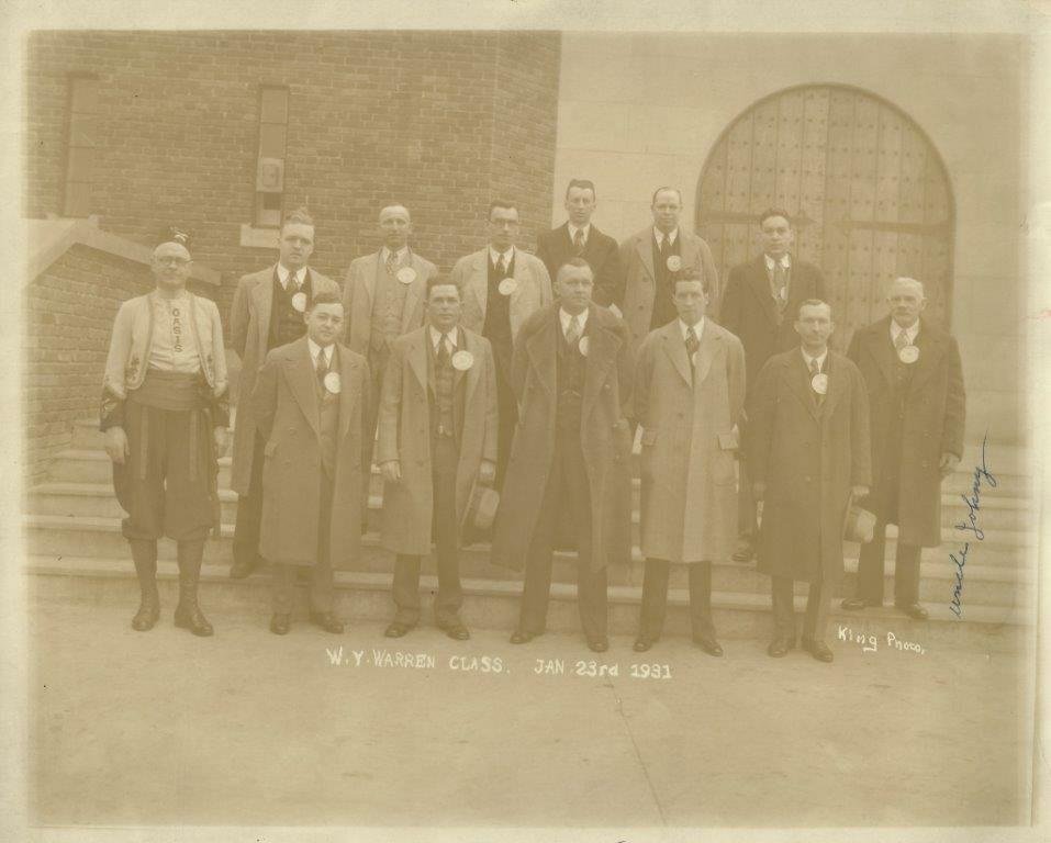 Can anyone identify anything in this photo. The man on the left has on a kind of "uniform" with the word OASIS down the front. The photo reads W.Y. Warren Class and is dated 1931. A long shot I know, but will give it a try.