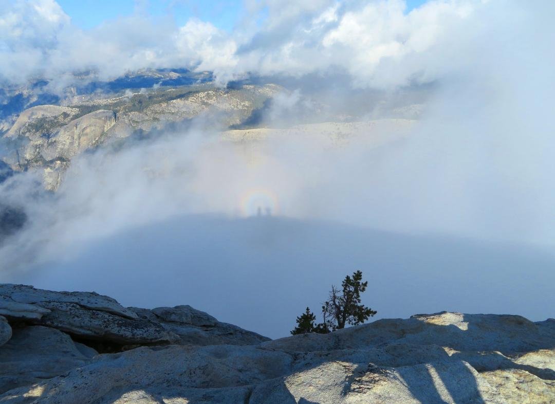 Rainbow surrounding our shadows on a distant cloud.  Me on the left and Matt on the right.  You can also see the shadow of Matt's legs on the rock bottom right.  Freaky.