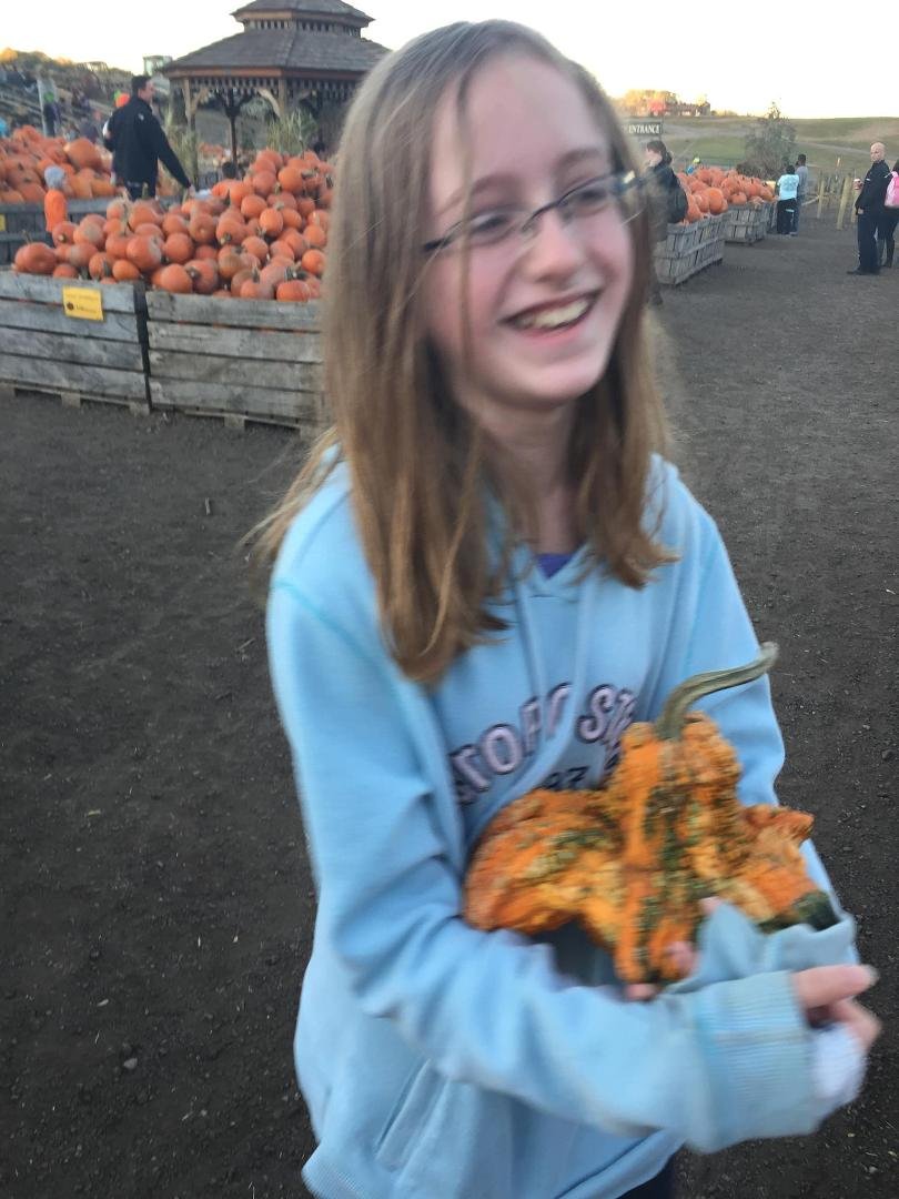 Tabby at Linville Orchards with her octopus gourd.