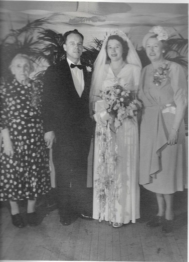 My favorite picture of my parents' wedding day:  Mrs. Bauerlein (I think it's so sweet that my Dad is holding her hand), my Dad & Mom, and Grandma.