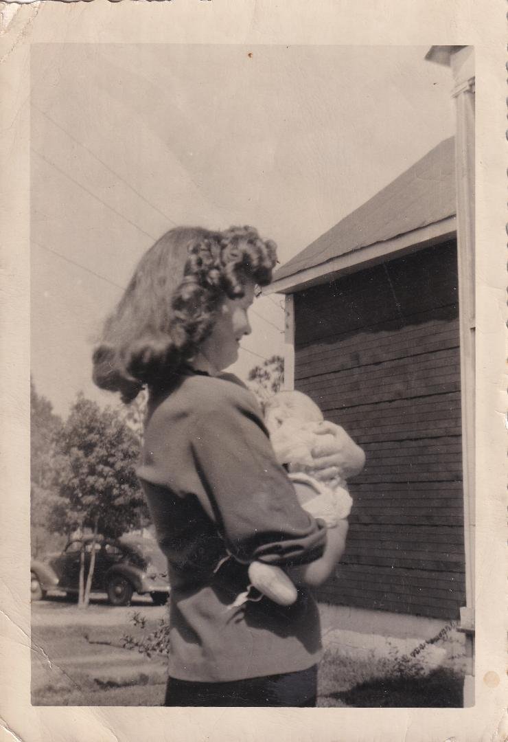 Mama holding my cousin Elaine about 3 months before I was born.