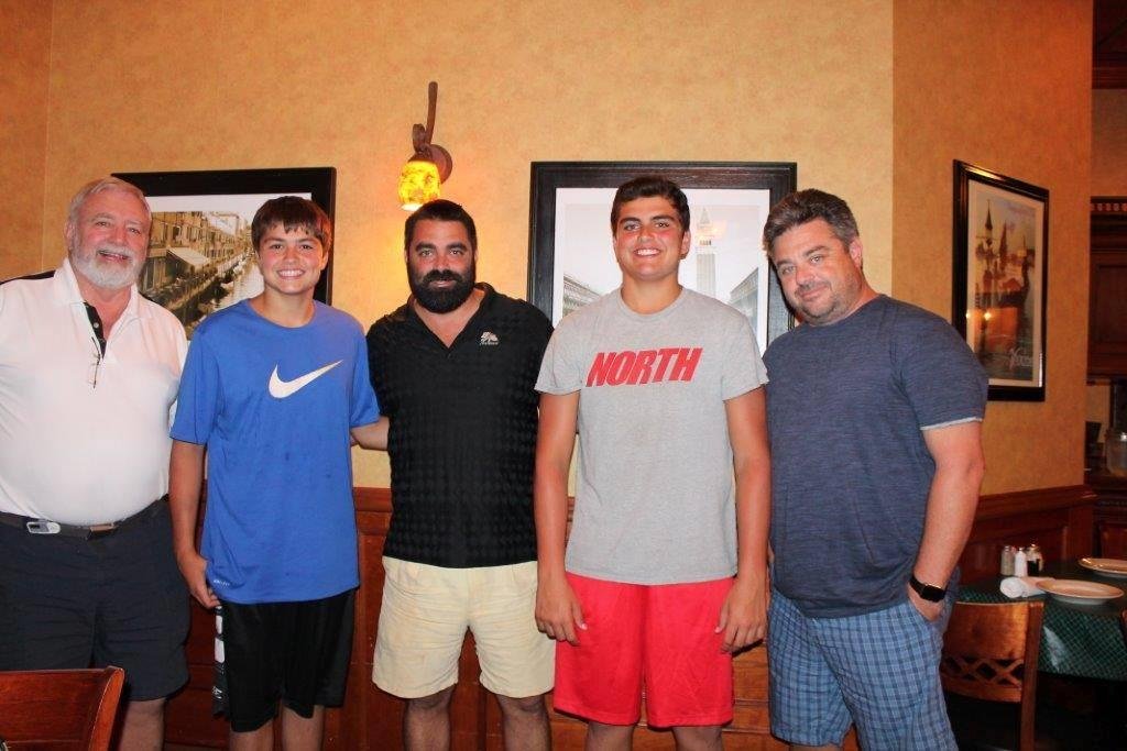 The Miles boys celebrating Joshua's birthday last summer. One of them is taller than I and the other is not too far behind. They are both taller than their dad and Uncle John.