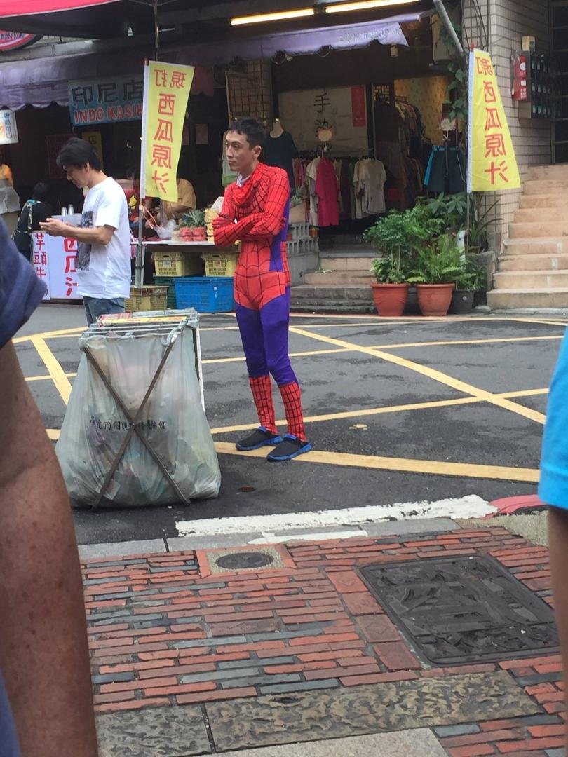 I guess even in Taiwan the superhero's need to take a break once in awhile... He didn't seem out of place at all to anyone except us, and he had taken his mask off so I guess everything was going OK that day...