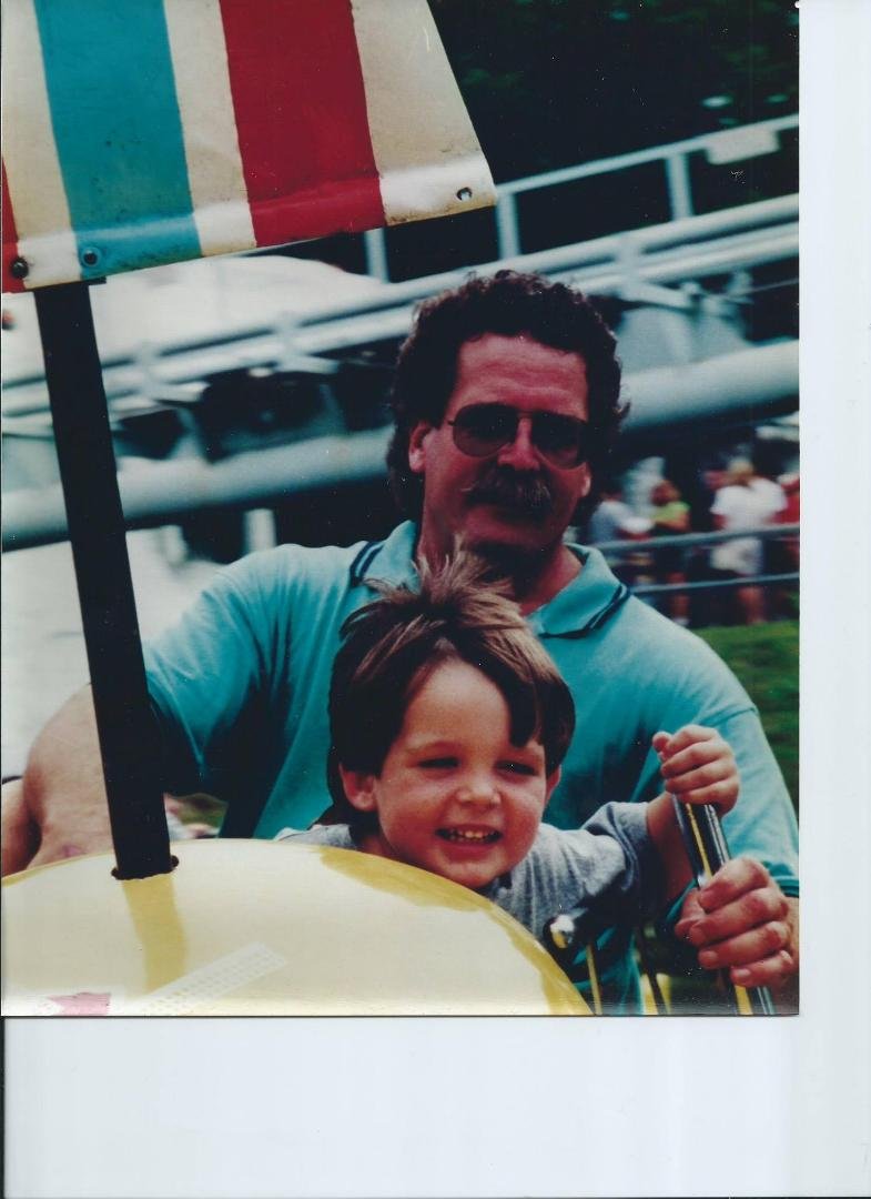 TBT at Storyland - me teaching Wyatt to fly Dumbo - 15 years ago?