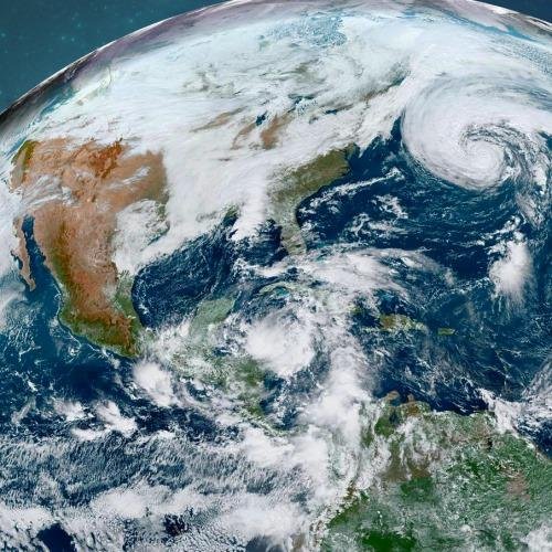 In the satellite photograph from yesterday afternoon you can see Hrcn. Epsilon in the upper right, while a developing tropical depression is in the western Carribean Sea. Interestingly, the outer high cloud shield of Hrcn.