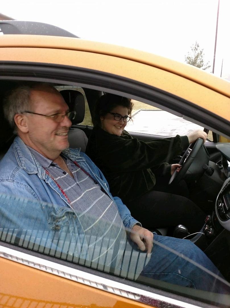 Having a good time teaching my granddaughter how to drive in the snow.