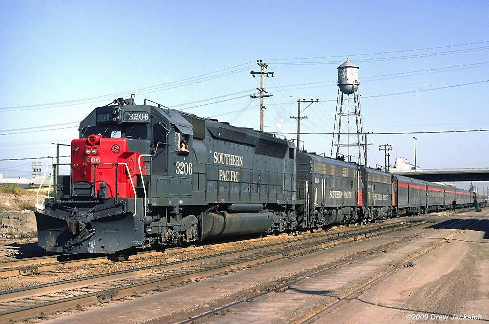 A clear Sunday in February of 1971 as SP Train #11, the southbound "Cascade" makes it's stop in Berkeley. This is the last stop before it's final stop at 16th St, in Oakland.