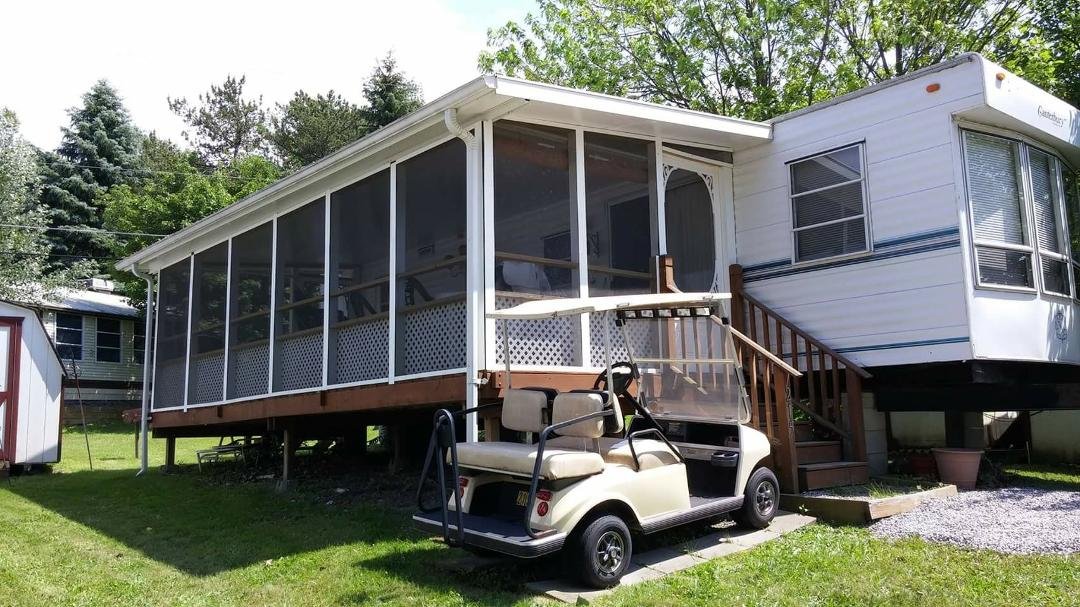 40' Trailer and lot for sale @ Leisurewood Recreation Campground on Cummings Rd Akron,NY.... New floor inside...stoned driveway...a great Sun room/porch....water tank put in for the months of no water..resealed on outside.