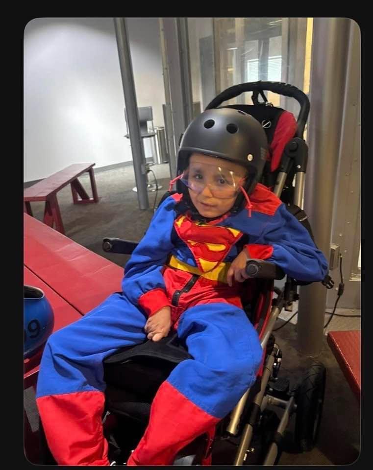 My grandson got to be Superman at the indoor parachuting club for his birthday.