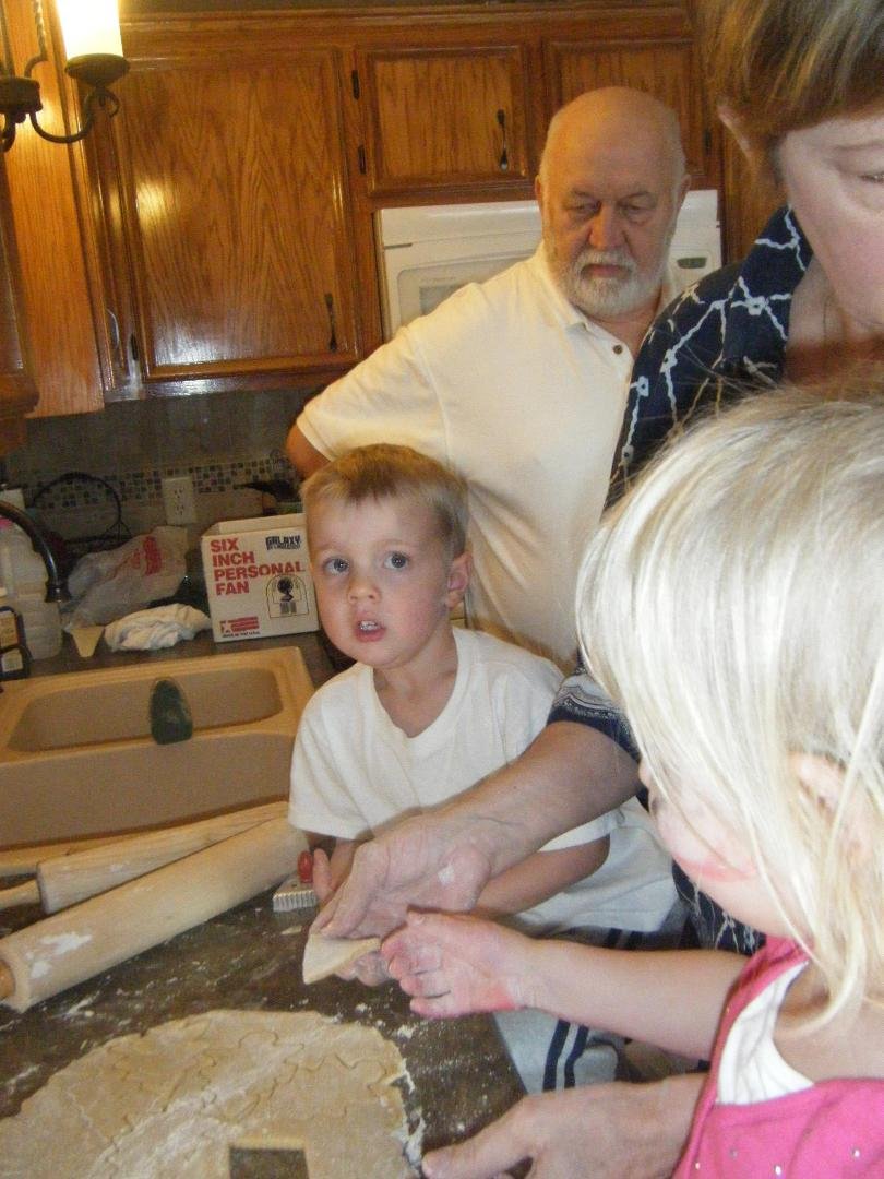 Papa overseeing the cookie-making, with Lucas and Frannie
