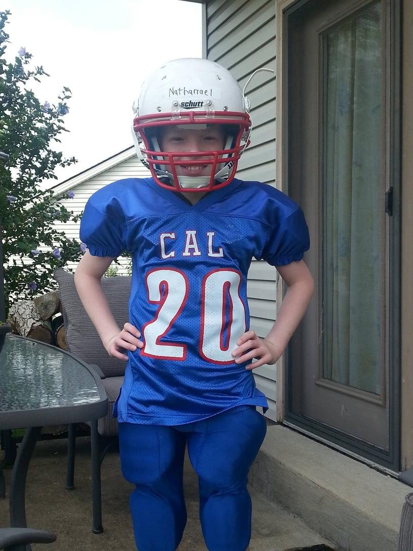 David's son Nathanael in his first real football uniform...he's going to play for his school team this coming season. He will be in the 5th grade.
