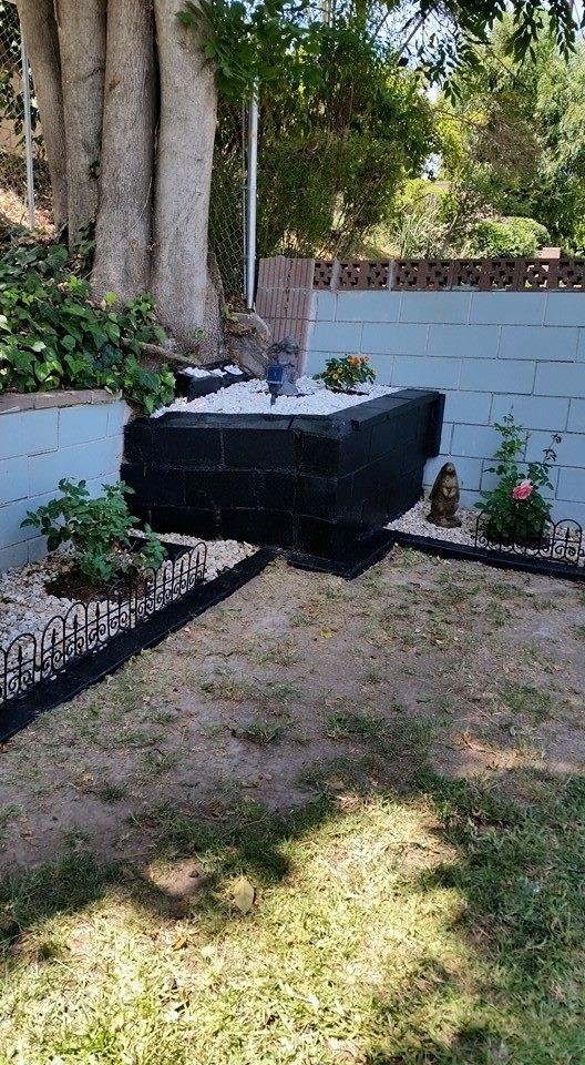 I have been working very hard to redo all of the flower beds in our backyard but I had one empty spot. Yesterday my absolutely wonderful husband bought me an early Mother's Day present. Please meet Peter the Rabbit who is n