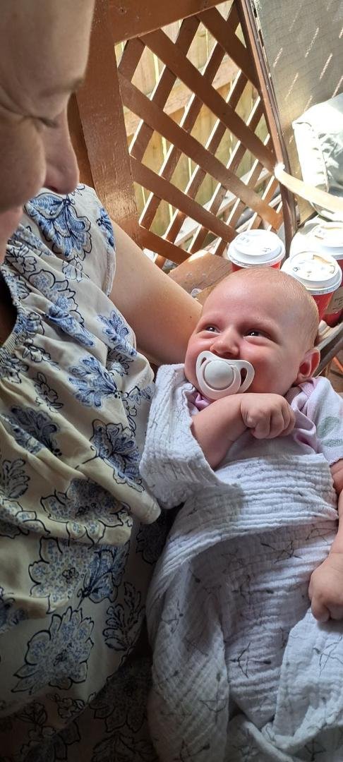 Our beautiful Harper smiling for Mommy almost a month old