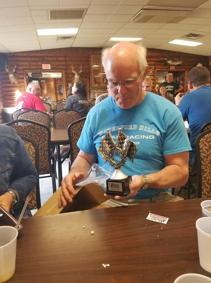 Dr Murphy looking at his first place trophy