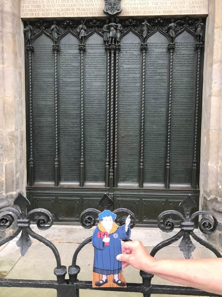 Flat Martin at the door of Castle Church in Wittenberg where legend has it that he posted his 95 thesis.