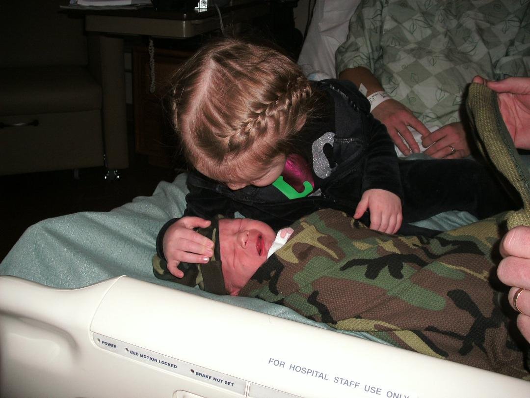 Big Sister checking Cooper over