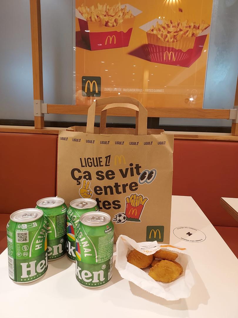 I'd like 4 Heinekens please.
Do you want fries with that?
No. McNuggets please.