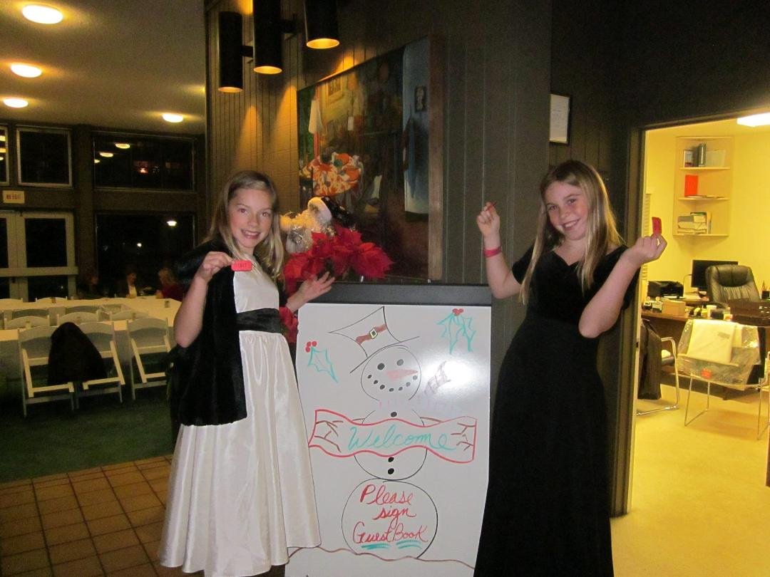 My Andie and her bff Carys manned the Guest Book at our 2014 Holiday Party at Strawberry Shores. Amy was the artist for the sign!