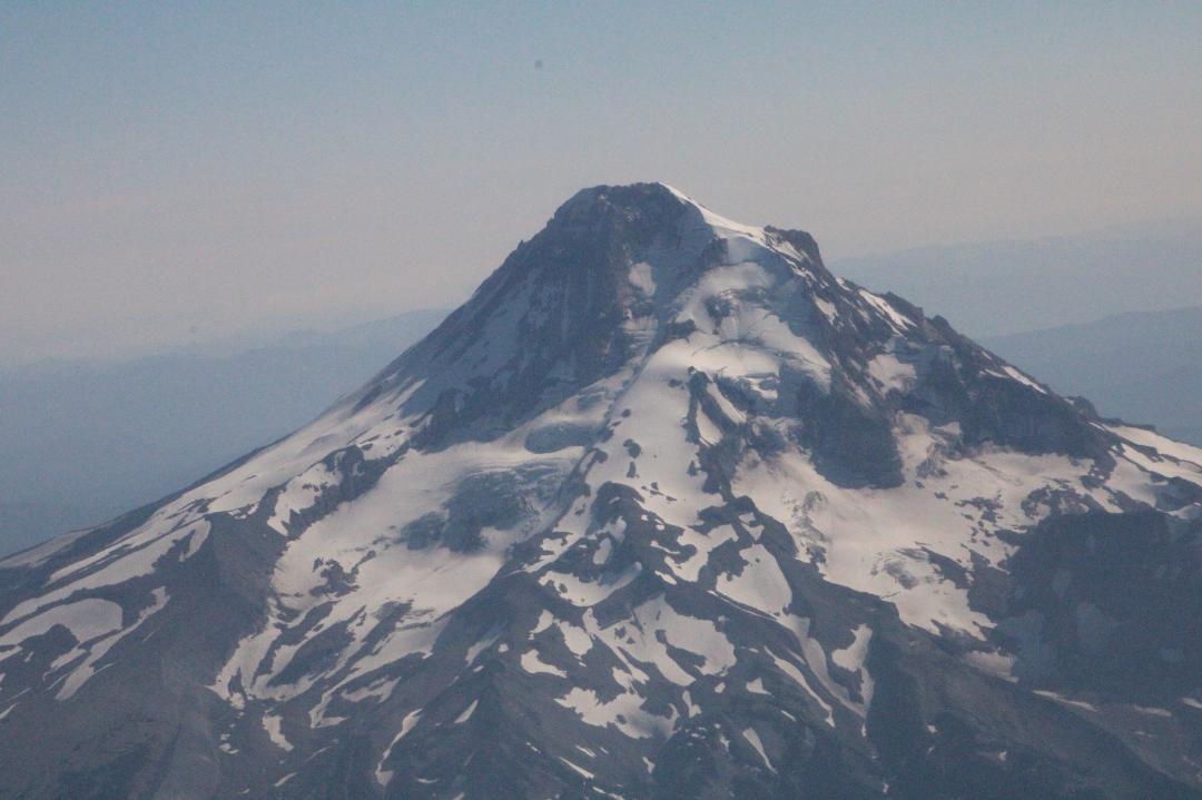 On the way home from the wedding in New York of Joel and Savannah Schlitzer, the pilot gave us an in-your-face view of Mt Hood.