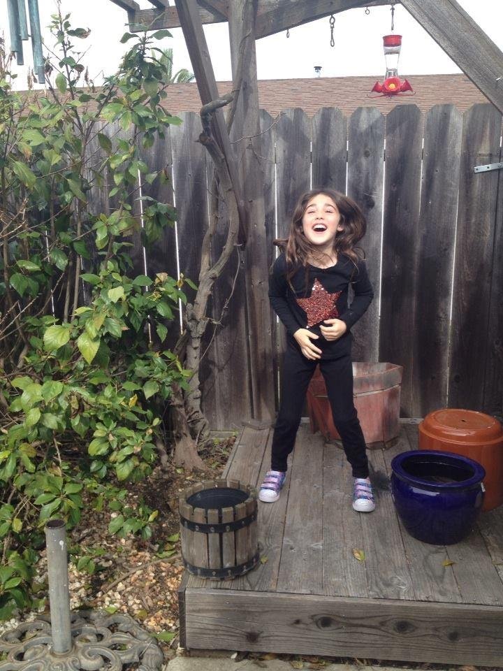 Beautiful granddaughter singing in the afternoon.