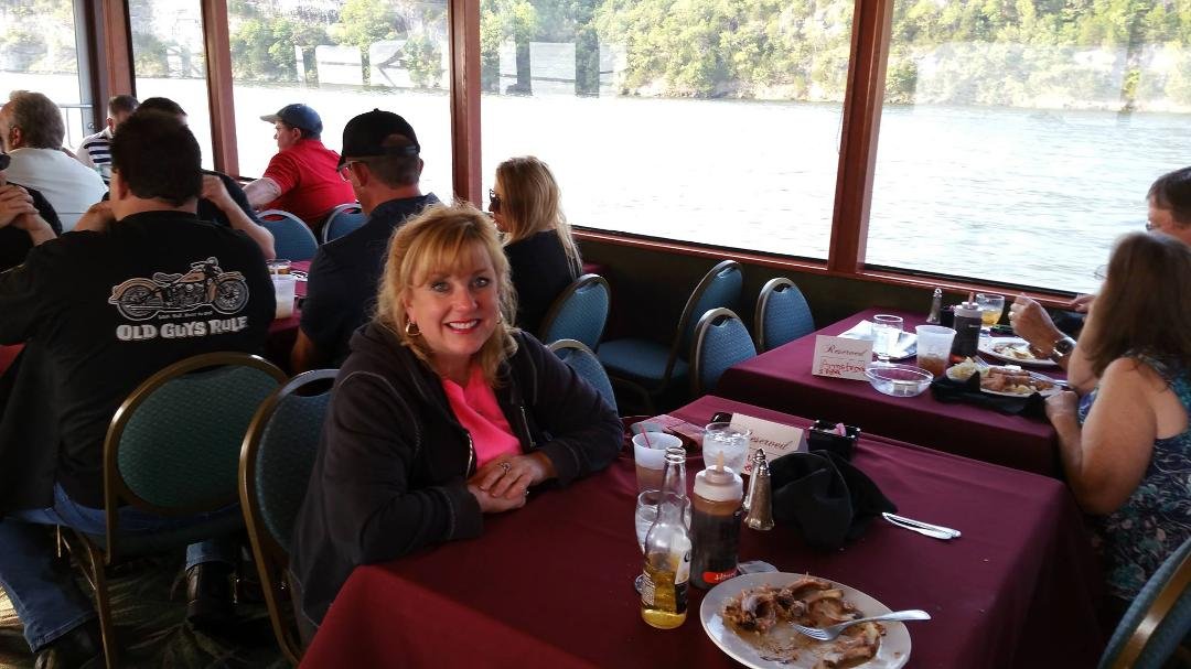 Eating BBQ while boating on the lake.