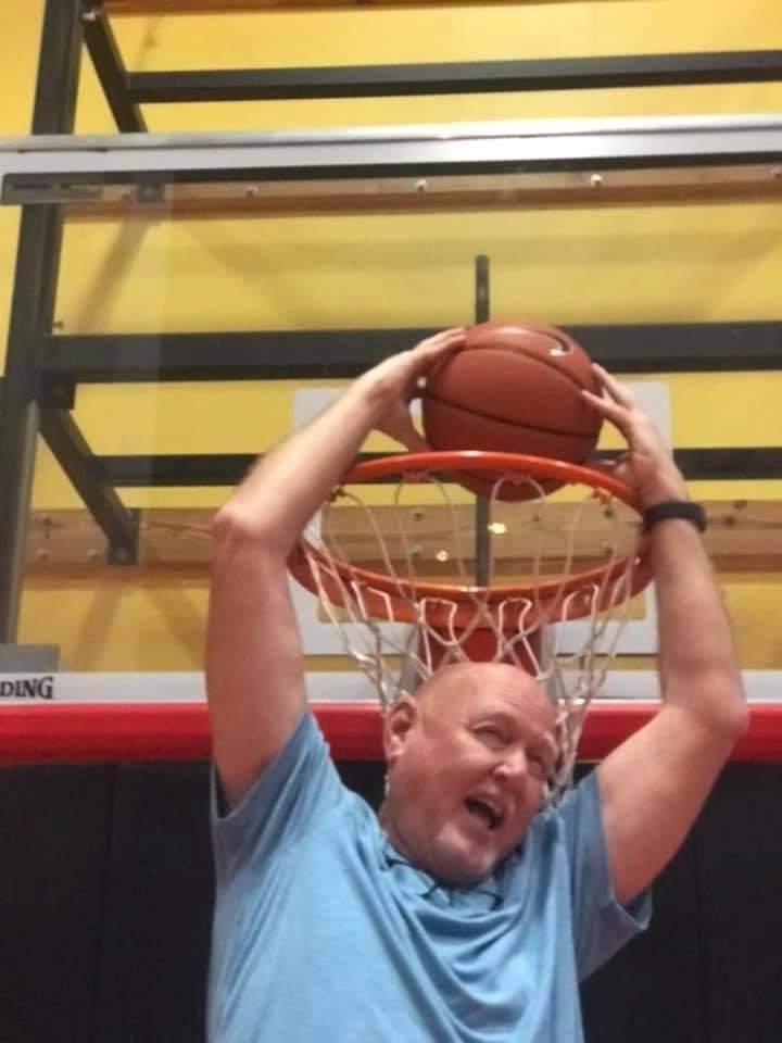 Showing them how to dunk the ball