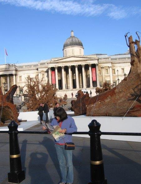 Julie studying where to go next while standing in Trafalgar Square, at the heart of London. Nov. 16, 2009