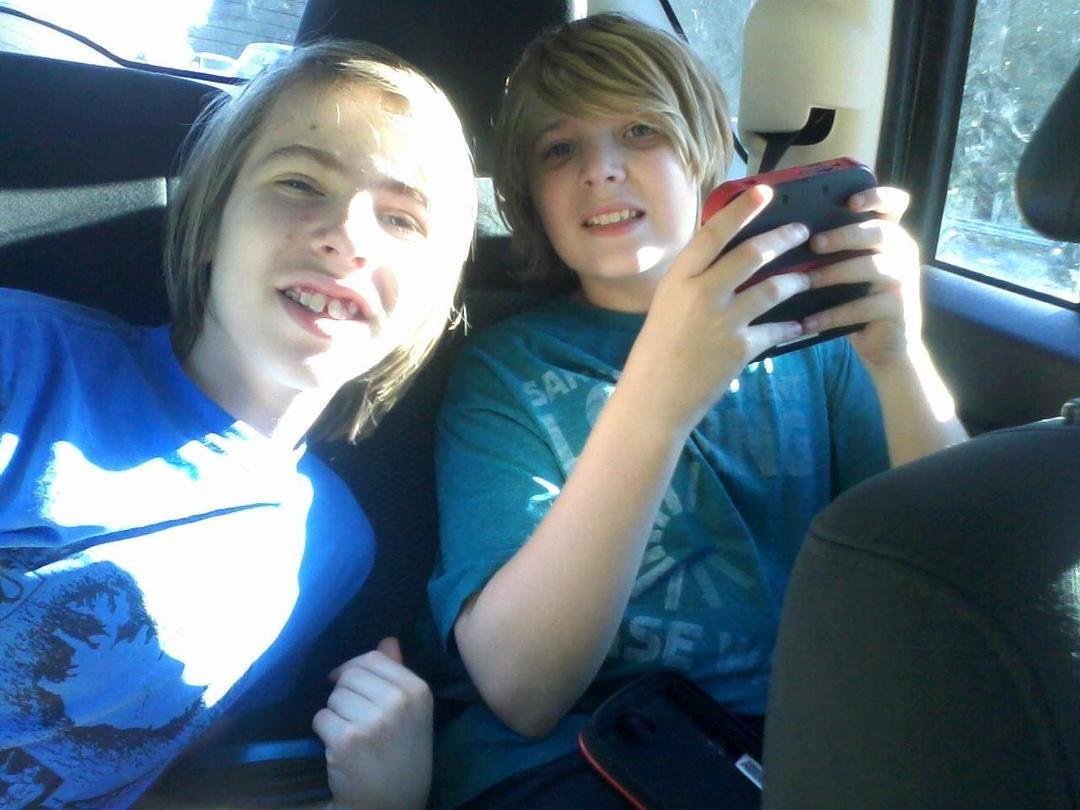 Leif and Richard in the back seat on the way home from a fun family outing.
