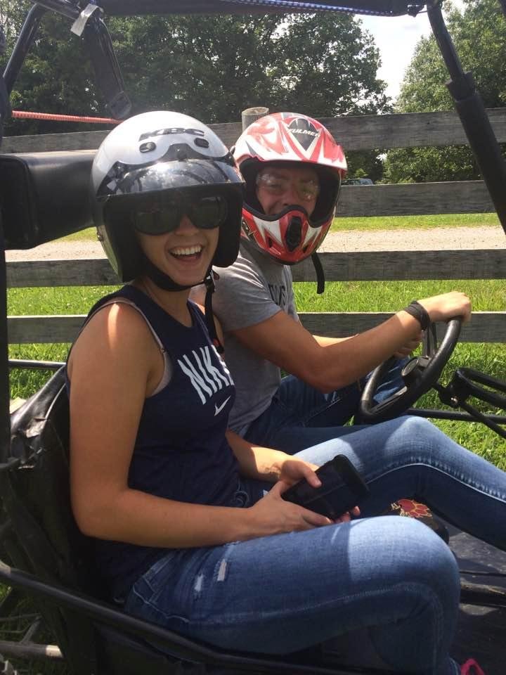 Our grandson,Derek & his girlfriend enjoying a ride on the go cart at our cabin!