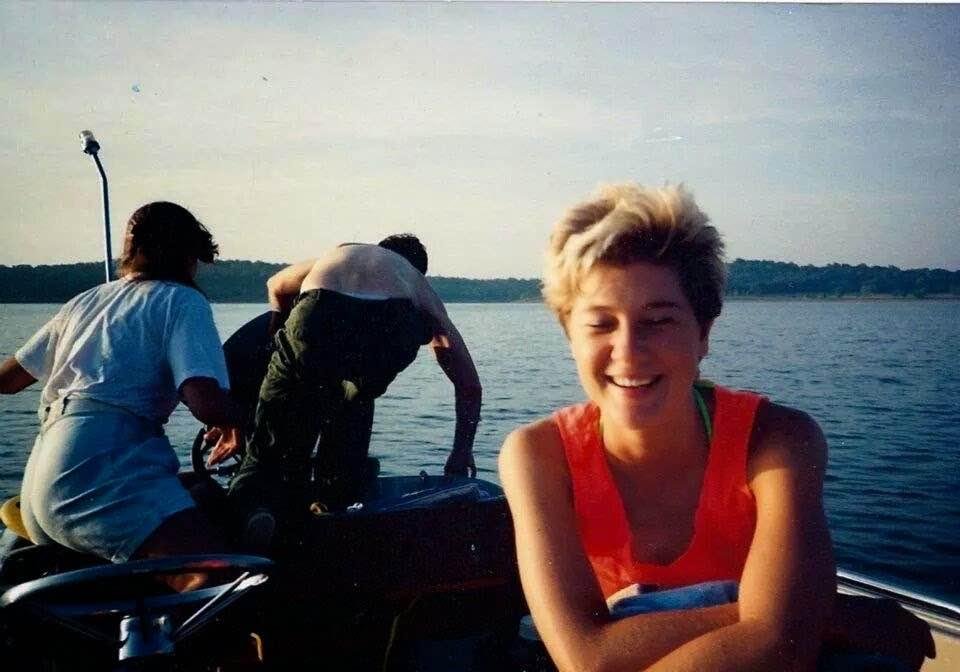 Kelli thinks it is funny that Sandi is shoving these guys into the water and is going to steal their boat.