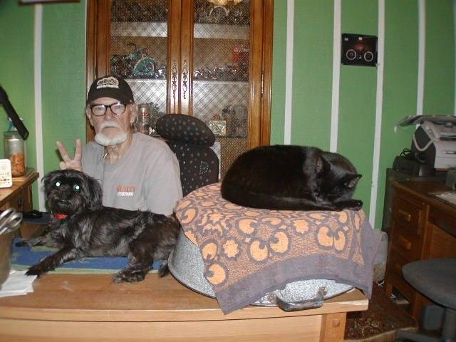 DADDY GEORGE  WITH TRAVELLER THE CAT & MINNIE, G'S SHADOW. SHE LIKES TO SIT ON THE DESK LIKE A CAT.