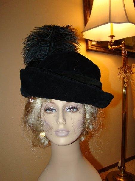My favorite mannequin head with her period hat and ostrich feather!