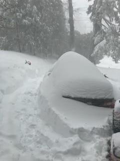 A friends front yard driveway & his car covered in snow! Lake Arrowhead CA