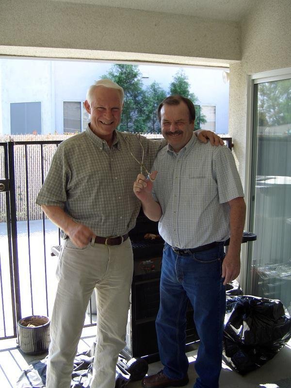 This is a pic of Mike and I in 2006 at his aunt Mick's house. Mike was BBQ'ing some chicken, and being playful with his tongs. Mike died this morning, and I'll sure miss his sense of humor. It's hard to think that this was 