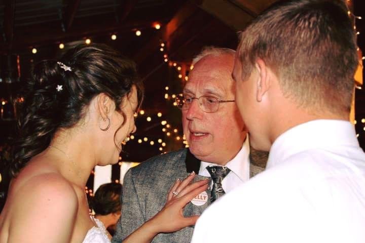 Showing my grandson's wife my belly button at their wedding in Montana about 4 years ago.:-)
