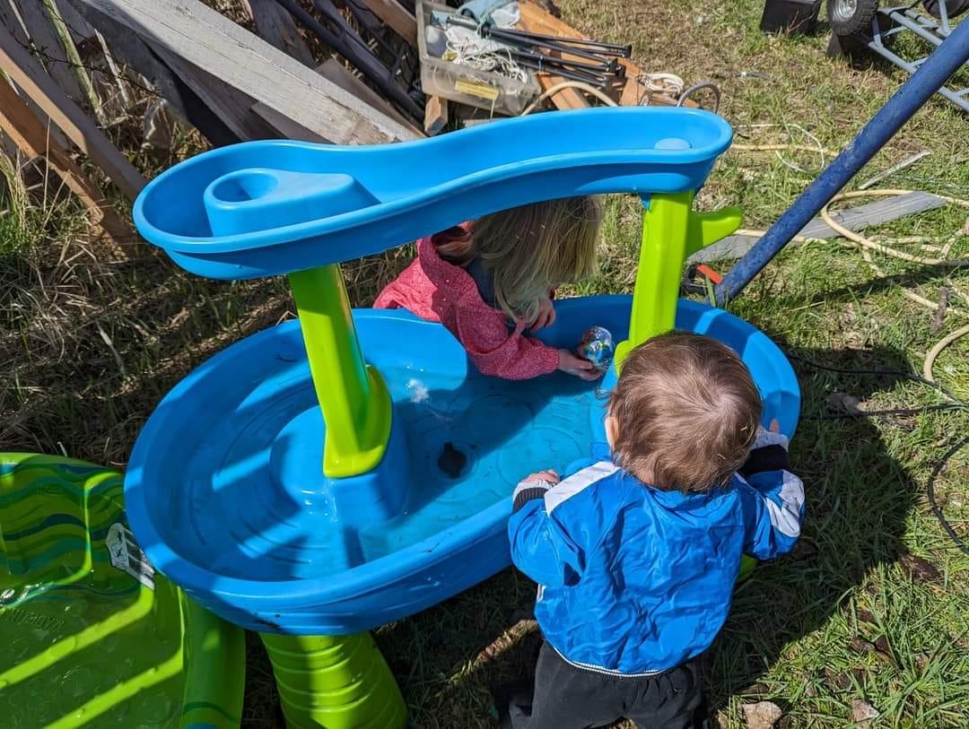 The 2 kiddos playing with the water table today. They had a blast today
