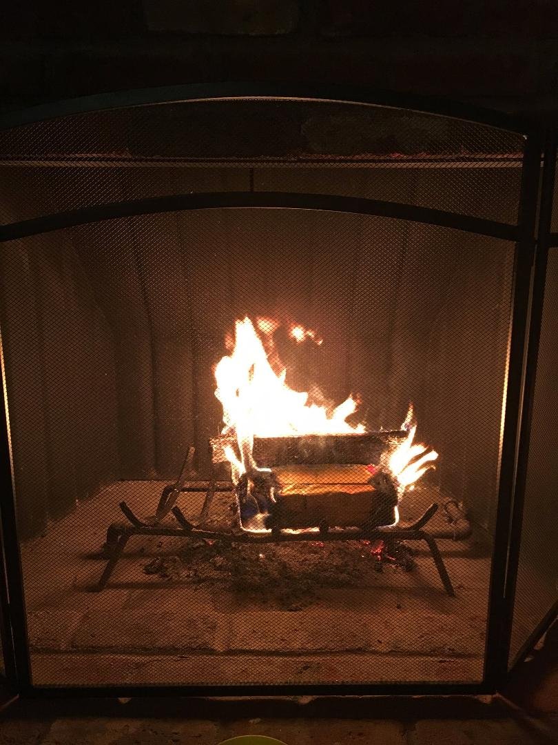 Enjoying the fire on this cool evening.