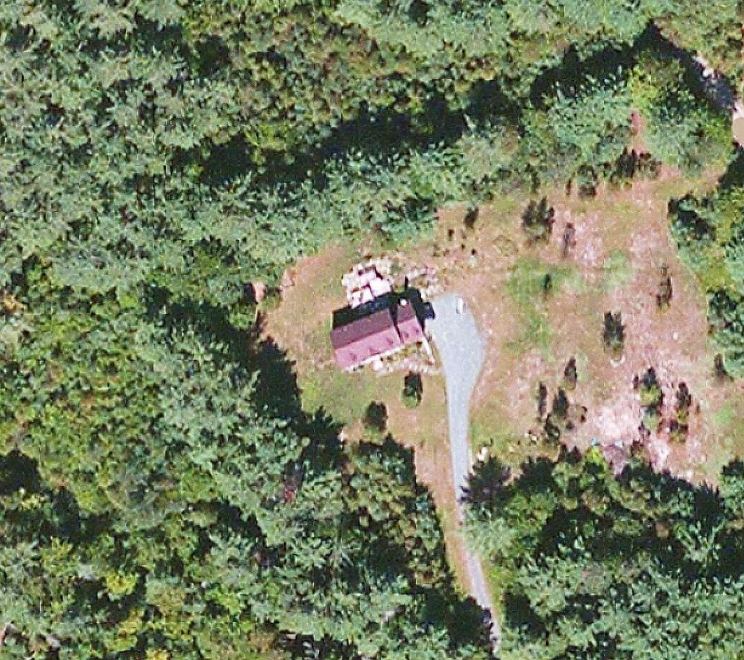 This is our house and yard in the woods of the White Mountains from the air.....a short walk in our backyard path is the Connecticut River/ Moore Lake