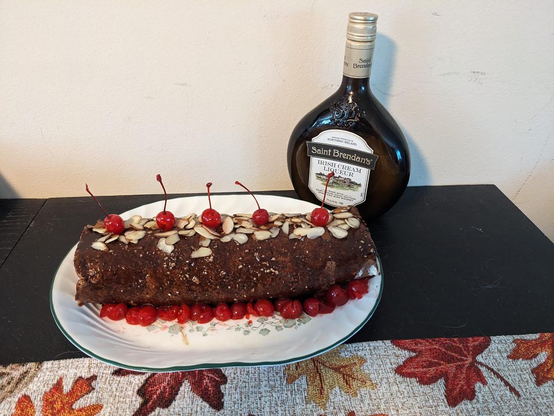 Baileys Irish Cream almond chocolate jelly roll with cherries and whipped cream fillihg