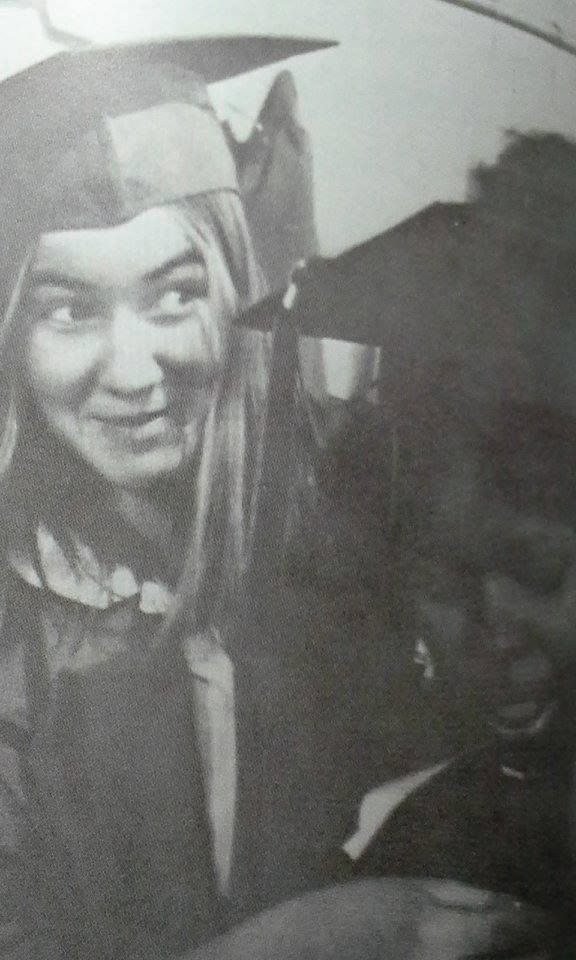 DENISE HALSEY HELPING FELLOW GRAD WITH HER OUTFIT.