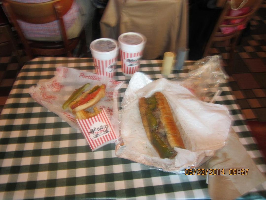 Chicago - Portillo's - Chicago Dog with everything - Big Italian Beef Sandwich - sweet peppers and wet. If you have to ask - you never ate one ;)